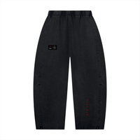 Villain Disruptor unisex mineral-wash barrel-leg pants by Wolvyn Apparel in charcoal with red Villain lettering.