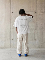 Wolvyn Apparel Foundations Stone Tshirt, white oversized boxy tee with black back print.