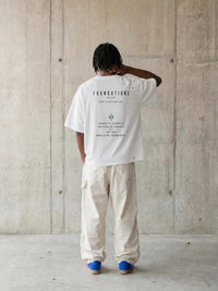 Wolvyn Apparel Foundations Stone Tshirt, white oversized boxy tee with black back print.
