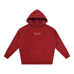 Oversized red fleece hoodie with hood up; white Wolvyn Apparel Foundations logo on chest, front view