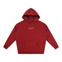 Oversized red fleece hoodie with hood up; white Wolvyn Apparel Foundations logo on chest, front view