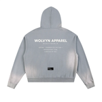 Zippered hoodie in light gray sun-fade fleece with large WOLVYN APPAREL SCOTTSDALE back print