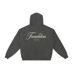 Hoodie back view in charcoal fleece zip-through with Foundations script logo; Wolvyn Apparel, ODMPOD Series 002.
