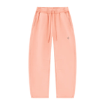 Wolvyn Apparel Foundations Layer 002 unisex peach vintage-wash fleece sweatpants, front view with drawstring pockets.