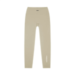 Wolvyn Apparel Standard Issue high-waisted yoga leggings in beige; flat-lay with white STANDARD ISSUE text along the outer leg.