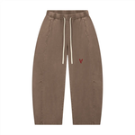 Pants: Villain by Wolvyn ODMPOD Disruptor mineral-wash barrel-leg unisex pants with white drawstrings and red V logo