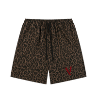 Villain by Wolvyn leopard print shorts with black drawstring and red logo.