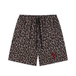 Unisex leopard print heavyweight shorts with drawstring and red V-shaped logo