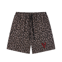 Unisex leopard print heavyweight shorts with drawstring and red V-shaped logo