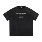 Tshirt in black vintage-washed fabric with hand-frayed edges and white WOLVYN APPAREL back graphic