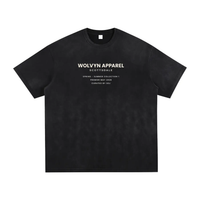 Tshirt in black vintage-washed fabric with hand-frayed edges and white WOLVYN APPAREL back graphic