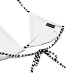 White triangle bikini top with black and white striped ties and a visible woven label