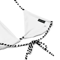White triangle bikini top with black and white striped ties and a visible woven label