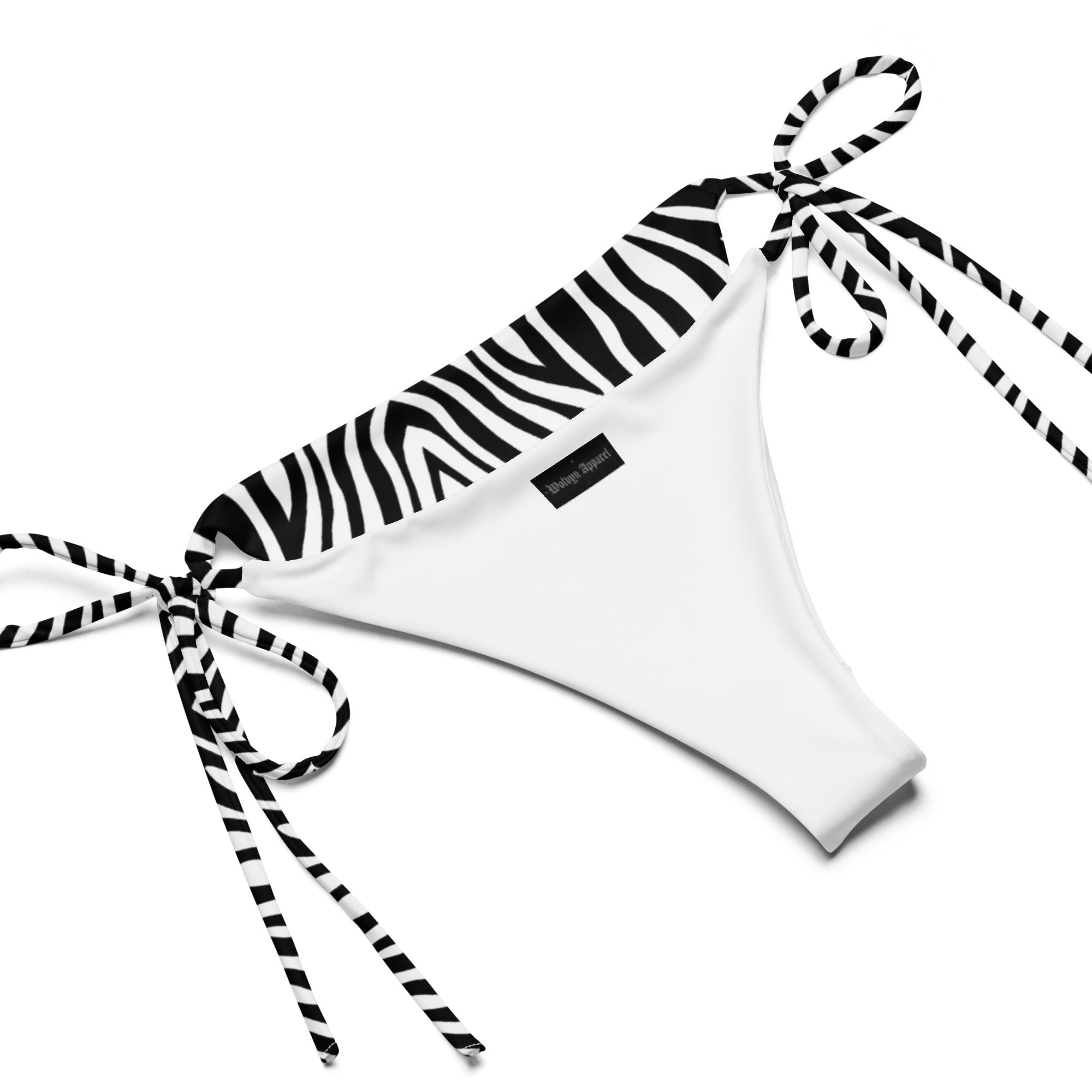 White string bikini bottom with zebra print trim and side ties on plain background