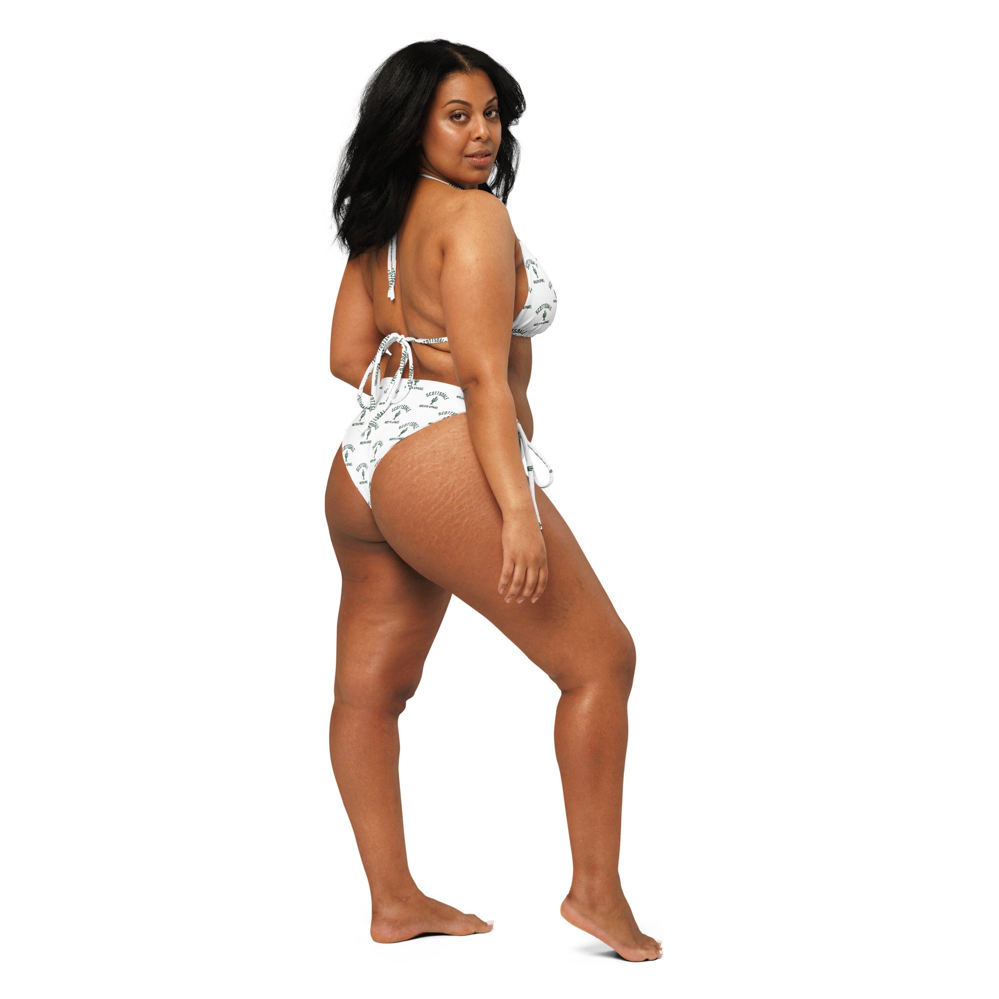 Woman modeling all-over print recycled string bikini with side ties on white background