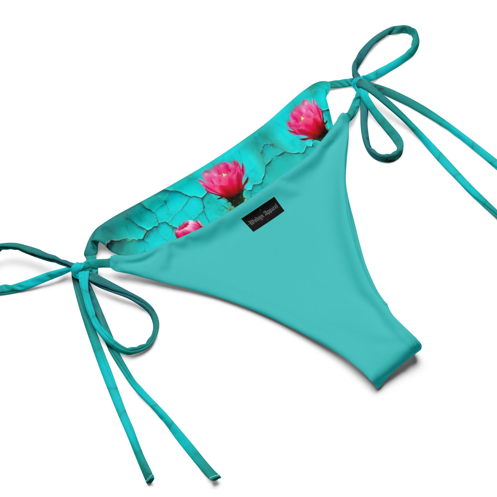Turquoise string bikini bottom with floral print trim and adjustable side ties on white background.