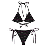Black recycled string bikini set with purple and white all-over print and tie details.