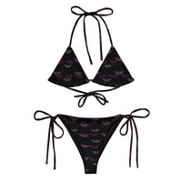 Black recycled string bikini set with purple and white all-over print and tie details.