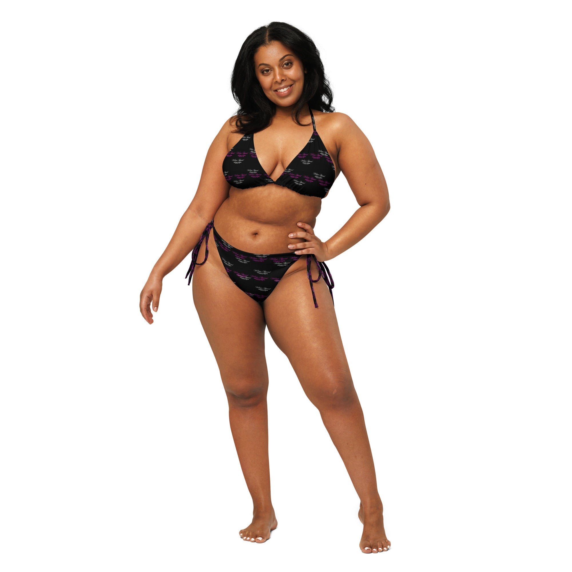Woman modeling black all-over print string bikini with side ties on white background