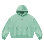 Wolvyn Apparel Foundations Layer 002 unisex vintage-wash mint boxy fleece hoodie, front view with kangaroo pocket.