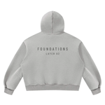 Wolvyn Apparel Foundations Layer 02 fleece hoodie, back view with FOUNDATIONS text, boxy unisex fit, Desert Luxury Streetwear.