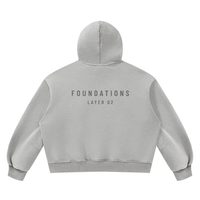 Wolvyn Apparel Foundations Layer 02 fleece hoodie, back view with FOUNDATIONS text, boxy unisex fit, Desert Luxury Streetwear.