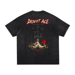 Back view of black vintage-washed T-shirt by Wolvyn Apparel with red Desert Ace graphic and desert landscape.