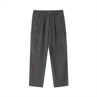 Dark gray cotton cargo pants with elastic waist, side pockets, and utility pockets.