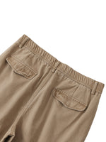 Beige cotton cargo pants with elastic waist and back flap pockets, streetwear style