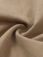 Close-up of beige cotton elastic waist cargo pants fabric, showcasing texture and weave