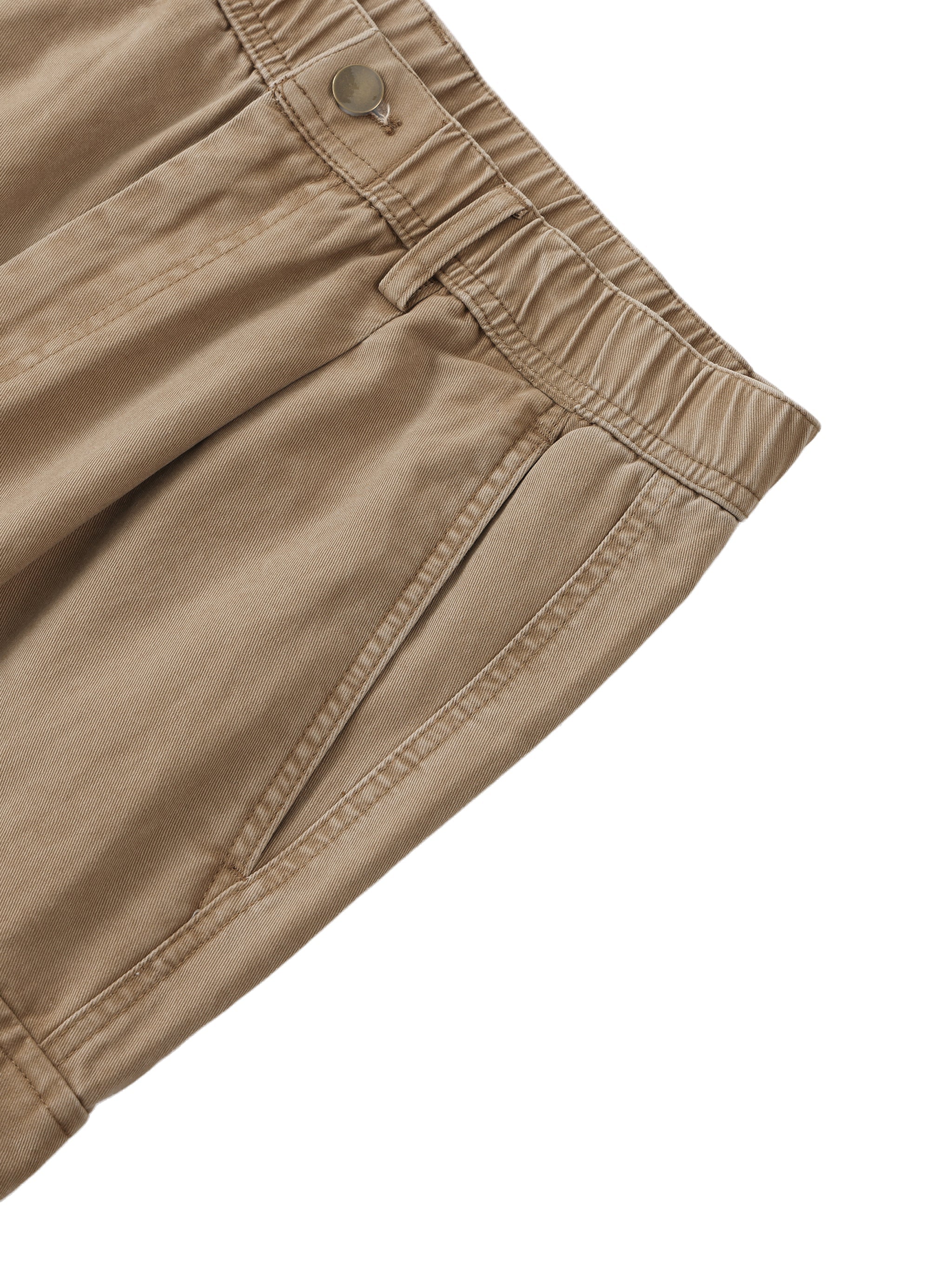 Close-up of khaki cotton cargo pants with elastic waistband and side pocket