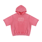 Wolvyn Apparel hoodie, pink mineral-wash short-sleeve with white chest print.