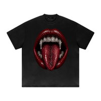 ODMPOD Wolvyn Apparel heavyweight drop-shoulder tee in black with front red lips, diamond fangs, and WOLVYN on tongue