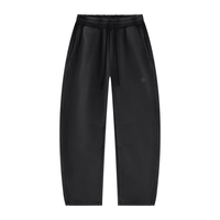 Wolvyn Apparel Foundations Layer 002 black vintage-wash fleece sweatpants with barrel-leg fit and drawstring waist.