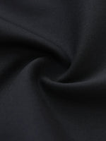 Close-up of black dress pants fabric with soft texture and elegant drape