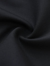 Close-up of black dress pants fabric with soft texture and elegant drape