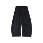 Black barrel-leg dress pants with wide cropped silhouette and front pockets on white background