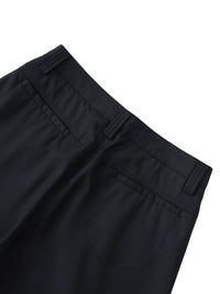 Close-up of black dress pants with belt loops and back pockets on white background
