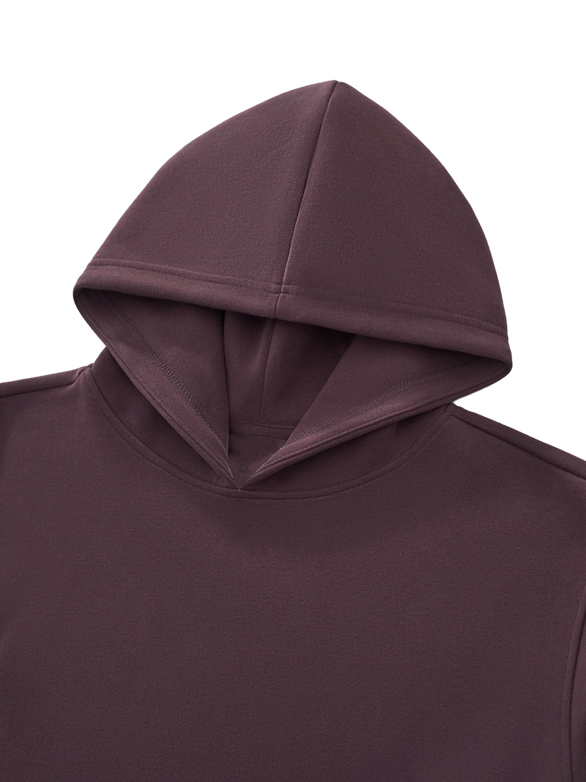 Close-up of a brown cropped hoodie with a heavyweight fabric and minimalist design