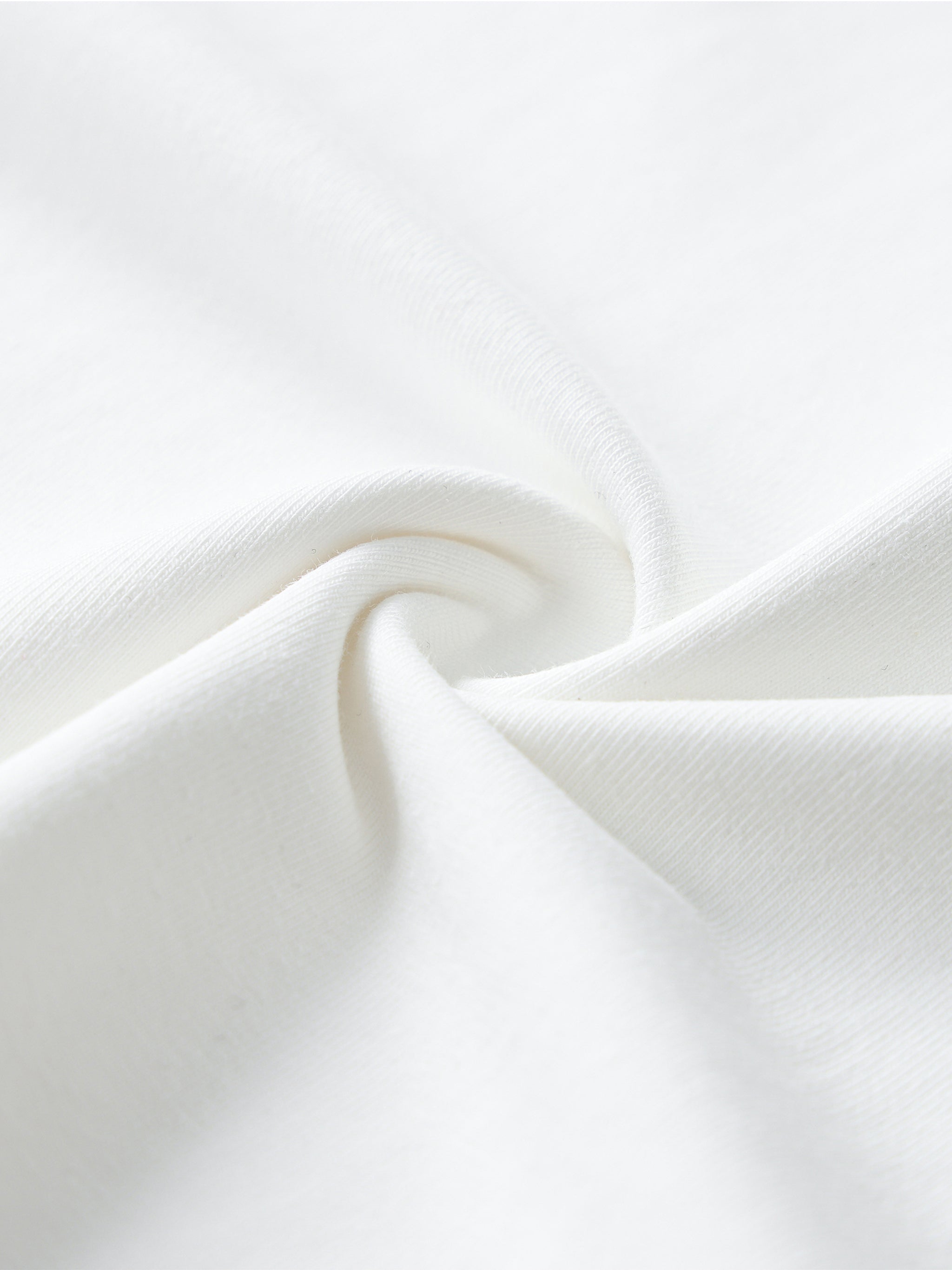 Close-up of white ribbed cotton T-shirt fabric with soft texture detail
