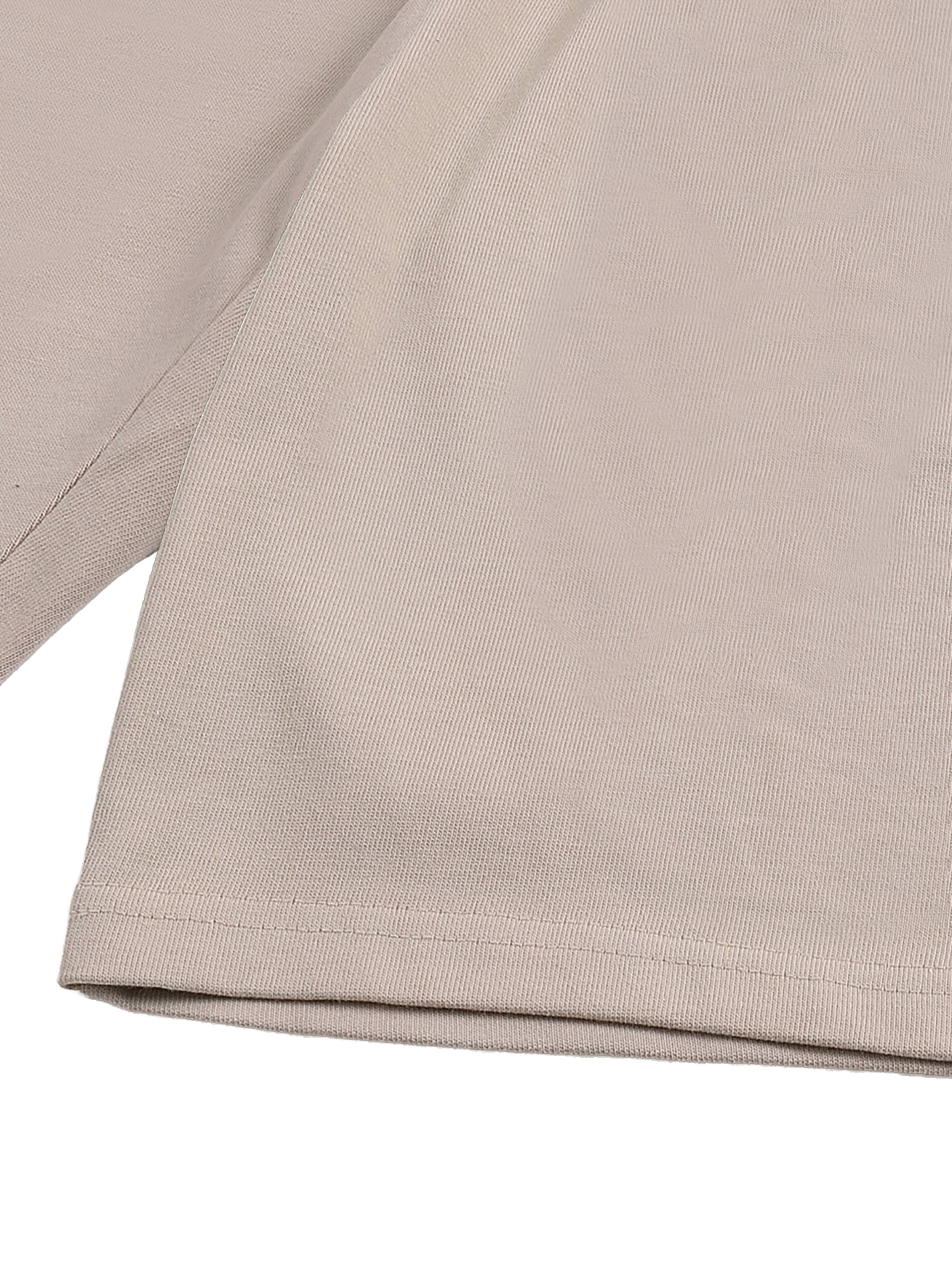Close-up of beige heavyweight cotton shorts with premium stitching detail