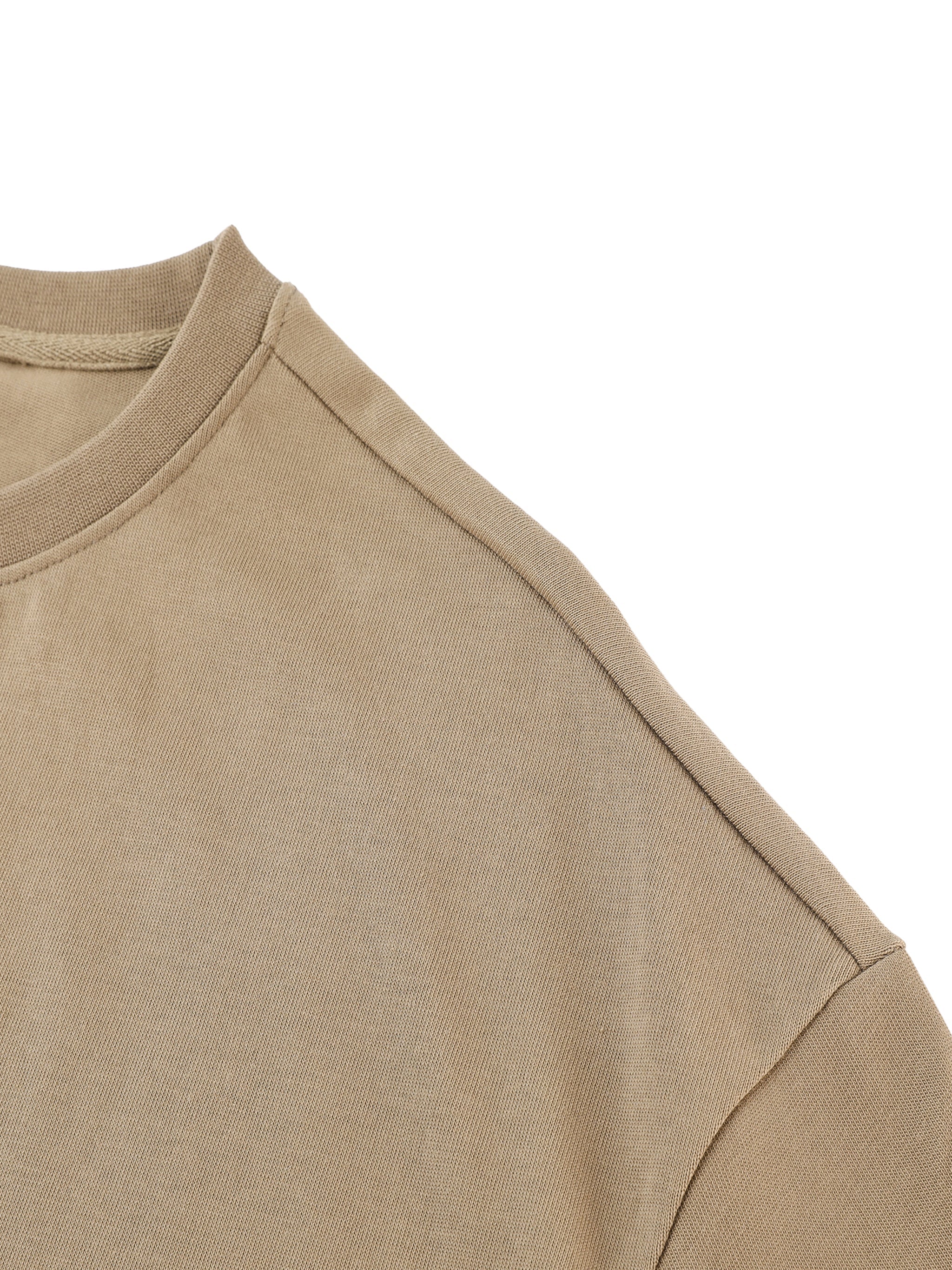 Beige heavyweight cotton t-shirt close-up showing shoulder seam and ribbed neckline