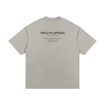 T-shirt back view in heather gray with Wolvyn Apparel branding and Spring-Summer Collection 1 text