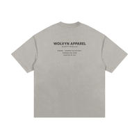 T-shirt back view in heather gray with Wolvyn Apparel branding and Spring-Summer Collection 1 text