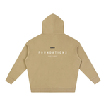 Wolvyn Apparel Foundations 002 Oversize Fleeced Hoodie back view in tan with white FOUNDATIONS text across the back.