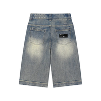 Wolvyn Apparel vintage wash baggy denim shorts with faded back pockets and a visible label patch on the rear right pocket