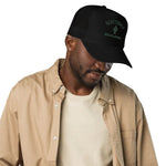 Man wearing black foam trucker hat with mesh back, cactus graphic, and SCOTTSDALE text