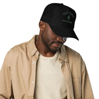 Man wearing black foam trucker hat with mesh back, cactus graphic, and SCOTTSDALE text