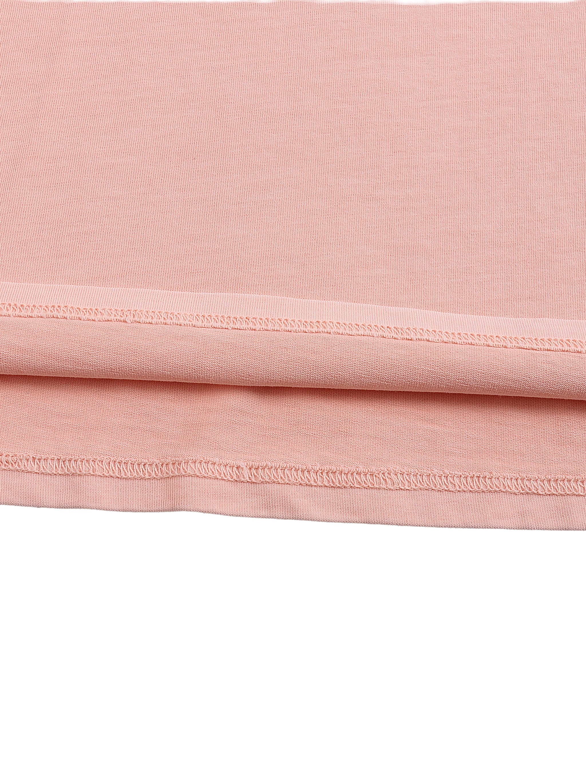 Close-up of pink heavyweight streetwear shirt hem with double-stitched seam detail