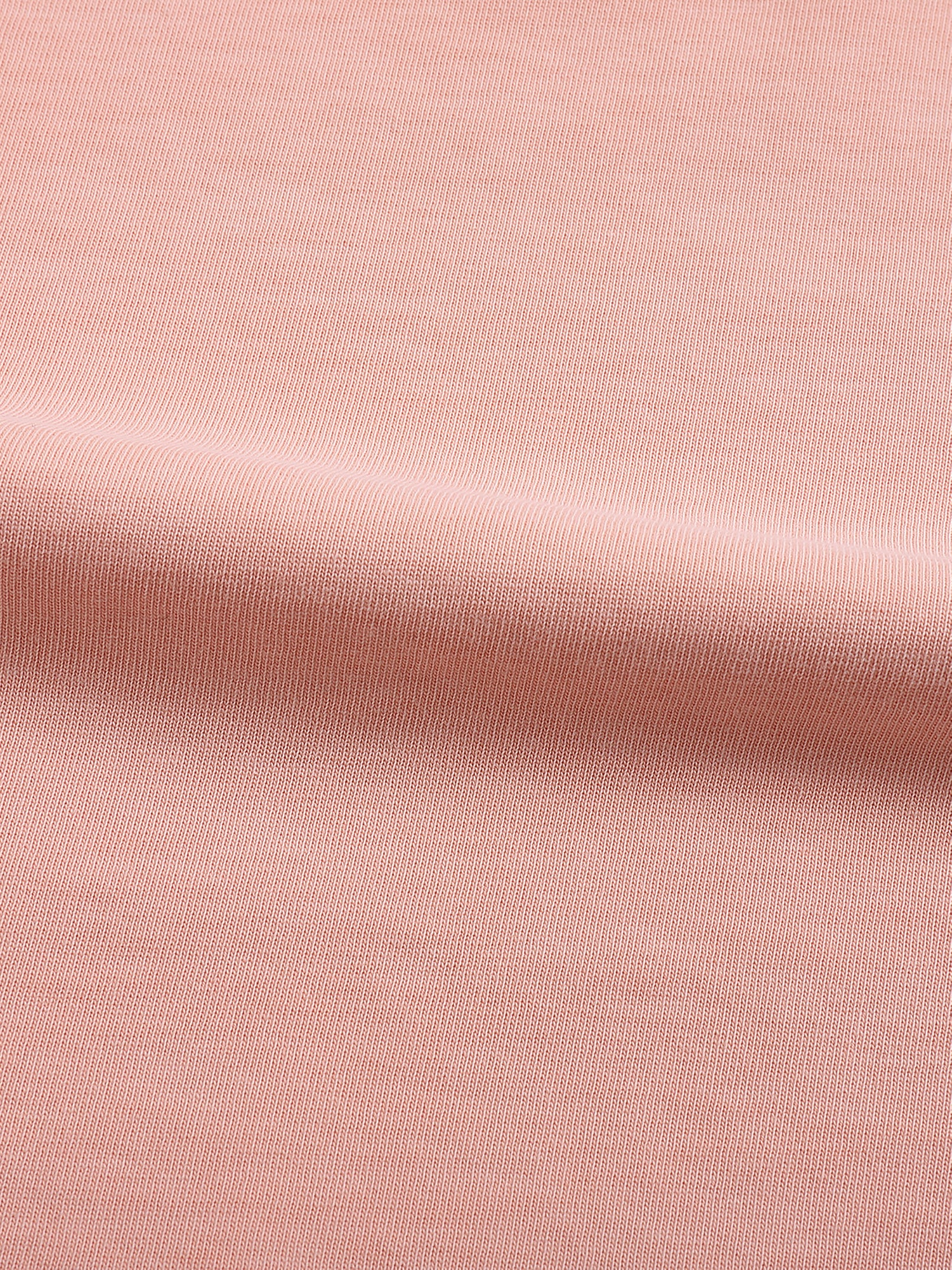 Close-up of heavyweight blush pink cotton fabric texture with soft ribbing